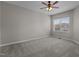 Bedroom with neutral walls, carpet, ceiling fan, and a window for ample natural light at 5320 Jessip St, Morrisville, NC 27560