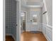 Welcoming entryway with hardwood floors, coat hooks, and decorative wall accents at 5320 Jessip St, Morrisville, NC 27560