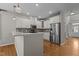 Modern kitchen featuring white cabinetry, stainless steel appliances, and granite countertops at 5320 Jessip St, Morrisville, NC 27560
