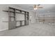 Loft featuring custom built-in shelving, neutral carpet, and a view of the stairwell at 5320 Jessip St, Morrisville, NC 27560