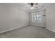 Spacious main bedroom boasts neutral carpet, a tray ceiling with fan, and plantation shuttered windows at 5320 Jessip St, Morrisville, NC 27560