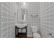 Stylish powder room with patterned wallpaper, pedestal sink, and classic fixtures at 5320 Jessip St, Morrisville, NC 27560