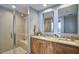 Luxurious en suite bathroom with glass shower and double vanity at 601 W Rosemary St # 416, Chapel Hill, NC 27516