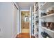 Walk-in closet with built-in shelving and views of en suite bathroom at 601 W Rosemary St # 416, Chapel Hill, NC 27516