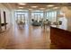 Open clubhouse area with comfortable seating, dining tables, and serving area for residents' use at 601 W Rosemary St # 416, Chapel Hill, NC 27516