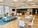 Clubhouse area featuring dining tables, sofa and booth style seating, TV, and stylish decor at 601 W Rosemary St # 416, Chapel Hill, NC 27516