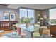 Dining room with large window, table with six chairs, and modern decor at 601 W Rosemary St # 416, Chapel Hill, NC 27516
