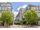 Modern building exterior with manicured landscaping, stone accents, and many windows at 601 W Rosemary St # 416, Chapel Hill, NC 27516