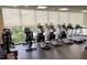 Well-equipped gym featuring modern exercise equipment and large windows at 601 W Rosemary St # 416, Chapel Hill, NC 27516