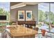 View of open kitchen with granite countertops, island, adjacent to dining table with modern decor at 601 W Rosemary St # 416, Chapel Hill, NC 27516