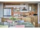 Open kitchen featuring wooden cabinets, stainless steel appliances, and an island at 601 W Rosemary St # 416, Chapel Hill, NC 27516