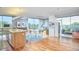 Bright, open-concept living space with hardwood floors and modern furniture, plus island with seating at 601 W Rosemary St # 416, Chapel Hill, NC 27516