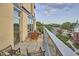Spacious outdoor patio with city views and patio furniture at 601 W Rosemary St # 416, Chapel Hill, NC 27516