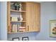 Wooden shelving with books, vases, and framed artwork at 601 W Rosemary St # 416, Chapel Hill, NC 27516