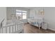 Bright Bedroom with two cribs, large window, and cute decor at 6415 Mentor Pl, Raleigh, NC 27616