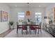 Bright dining room with modern furnishings and decorative pendant lighting at 6415 Mentor Pl, Raleigh, NC 27616