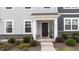 Charming entryway featuring stone accents and a covered porch, offering a welcoming entrance to the home at 6415 Mentor Pl, Raleigh, NC 27616