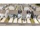 Aerial view of modern townhomes with solar panels and private driveways in a planned community at 6415 Mentor Pl, Raleigh, NC 27616