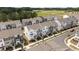 Aerial view of new townhomes in a community surrounded by green trees at 6415 Mentor Pl, Raleigh, NC 27616