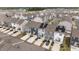 Aerial view of townhomes featuring a community complete with solar panels and driveways at 6415 Mentor Pl, Raleigh, NC 27616
