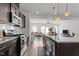 Open-concept kitchen flowing into a living room for seamless entertaining at 6415 Mentor Pl, Raleigh, NC 27616