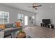 Spacious living room features wood-look flooring, modern lighting, and neutral decor at 6415 Mentor Pl, Raleigh, NC 27616