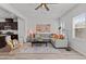 Comfortable living room features recessed lighting, ceiling fan, and cozy gray sofa at 6415 Mentor Pl, Raleigh, NC 27616