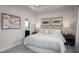 Serene bedroom boasts tray ceiling, soft lighting, neutral tones, and ensuite bathroom at 700 Tambor Rd, Durham, NC 27713
