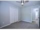 Bright bedroom with neutral carpet, double closet, and access to an attached bathroom at 722 Orchard Dr, Graham, NC 27253