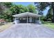 Charming single-story home with a wide carport and mature trees at 722 Orchard Dr, Graham, NC 27253