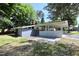 Attractive single-story home with a covered carport, brick accents, and a well-maintained lawn at 722 Orchard Dr, Graham, NC 27253