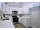 Kitchen features white cabinetry, quartz countertops, stainless appliances, and lots of storage space at 722 Orchard Dr, Graham, NC 27253
