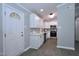 Charming kitchen showcasing white cabinets, quartz countertops, and stainless steel appliances at 722 Orchard Dr, Graham, NC 27253