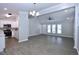 Open-concept living room featuring vaulted ceilings, and seamlessly connected to the kitchen at 722 Orchard Dr, Graham, NC 27253