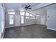 Spacious living room with lots of natural light and modern gray floors at 722 Orchard Dr, Graham, NC 27253