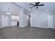 Open-concept living space with modern gray flooring and ample natural light at 722 Orchard Dr, Graham, NC 27253