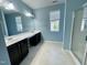 Bathroom featuring double vanity with large mirror and a separate glass-enclosed shower at 7241 Terregles Dr, Raleigh, NC 27617