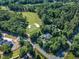 Aerial view of home near a golf course, highlighting its location and the surrounding landscape, and newly constructed home at 801 Pinehurst Dr, Chapel Hill, NC 27517