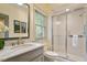 Bathroom features a vanity with marble countertop, white toilet, and a glass door shower at 801 Pinehurst Dr, Chapel Hill, NC 27517
