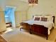 Bright bedroom featuring a stylish light fixture and an inviting bed with decorative pillows at 801 Pinehurst Dr, Chapel Hill, NC 27517
