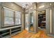 This custom closet has hardwood floors, lots of cabinet and shelf space with elegant wall coverings at 801 Pinehurst Dr, Chapel Hill, NC 27517