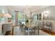 Refined dining room with a chandelier, large window, and elegant furnishings at 801 Pinehurst Dr, Chapel Hill, NC 27517