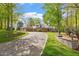 Spacious brick home with a long driveway and well-maintained landscaping at 801 Pinehurst Dr, Chapel Hill, NC 27517