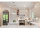 The well-equipped kitchen features white cabinets, granite countertops, and modern stainless steel appliances at 801 Pinehurst Dr, Chapel Hill, NC 27517