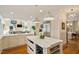 Gourmet kitchen featuring an island, stainless steel appliances, and open layout at 801 Pinehurst Dr, Chapel Hill, NC 27517