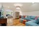 Bright living room with hardwood floors, recessed lighting, and an adjacent bedroom at 801 Pinehurst Dr, Chapel Hill, NC 27517