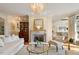Inviting living room featuring a fireplace, hardwood floors, and ample natural light at 801 Pinehurst Dr, Chapel Hill, NC 27517