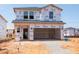 A two-story home in the early stages of construction showcasing its Tyvek-protected exterior at 824 Ottawa Dr, Garner, NC 27529