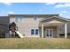 Backyard view of home featuring covered patio and playset at 833 Ember Dr, Durham, NC 27703