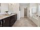 Granite countertop and modern fixtures in this neutral toned well-lit bathroom at 833 Ember Dr, Durham, NC 27703
